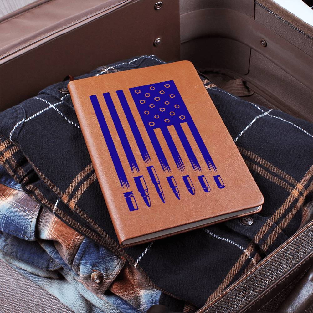 This American flag journal with bullet holes in blue on a vegan leather 100 page, lined journal may just be the best gift ever