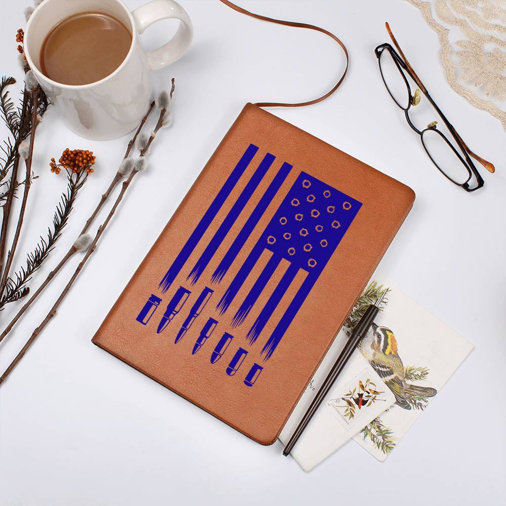 This American flag journal with bullet holes in blue on a vegan leather 100 page, lined journal may just be the best gift ever