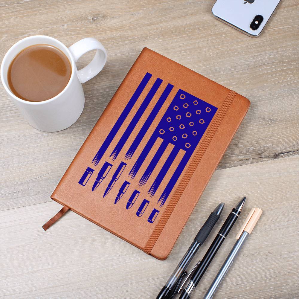 This American flag journal with bullet holes in blue on a vegan leather 100 page, lined journal may just be the best gift ever