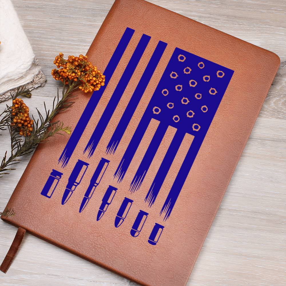This American flag journal with bullet holes in blue on a vegan leather 100 page, lined journal may just be the best gift ever