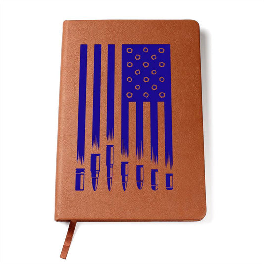 This American flag journal with bullet holes in blue on a vegan leather 100 page, lined journal may just be the best gift ever