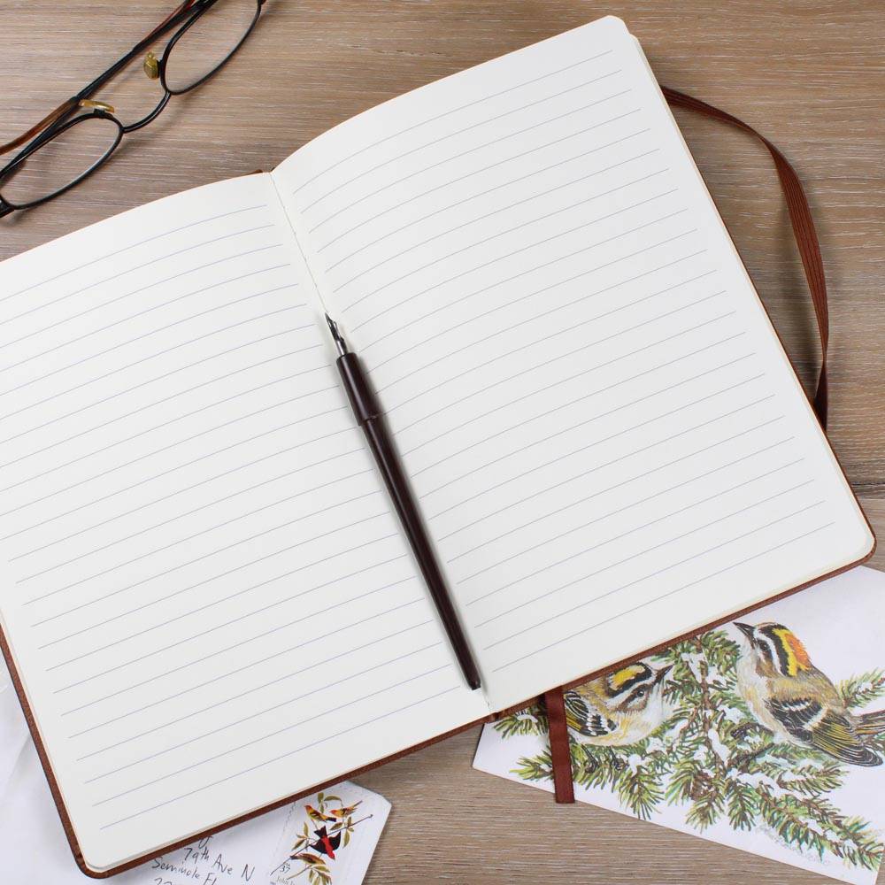 This American flag journal with bullet holes in blue on a vegan leather 100 page, lined journal may just be the best gift ever